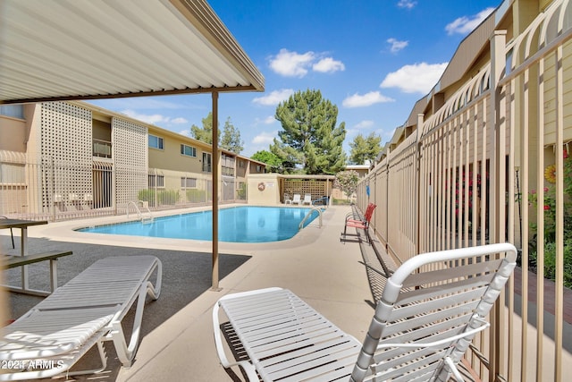 view of swimming pool with a patio area