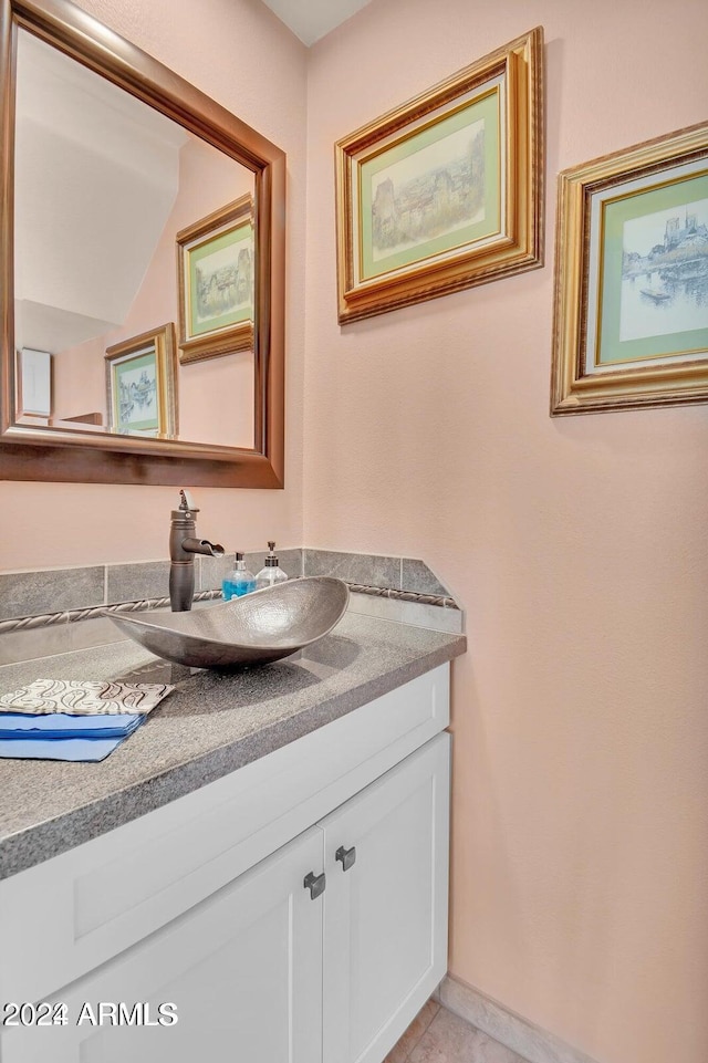 bathroom featuring tile patterned floors and vanity