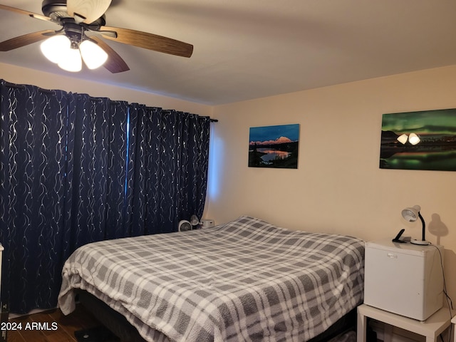 bedroom featuring hardwood / wood-style flooring and ceiling fan