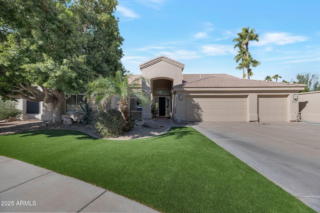 view of front facade with a garage and a front yard