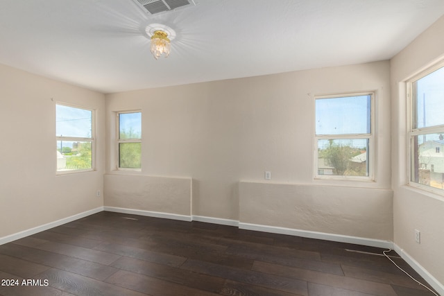 empty room featuring dark wood-type flooring