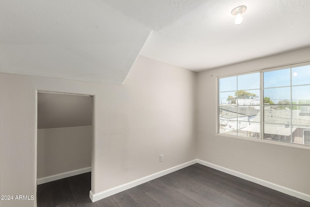 unfurnished room featuring dark hardwood / wood-style flooring