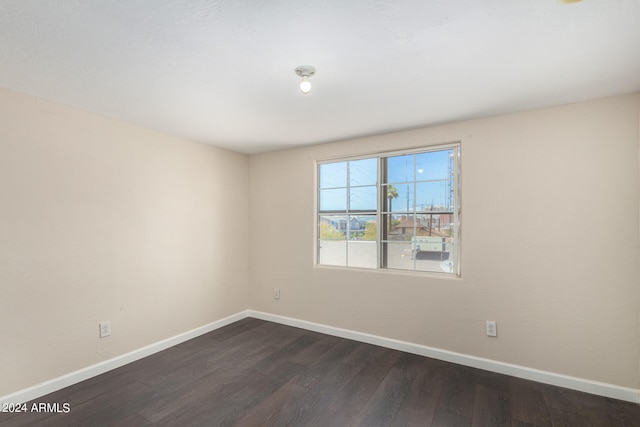 unfurnished room with hardwood / wood-style floors