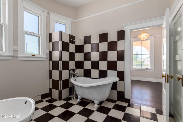 bathroom with tile patterned flooring and a washtub