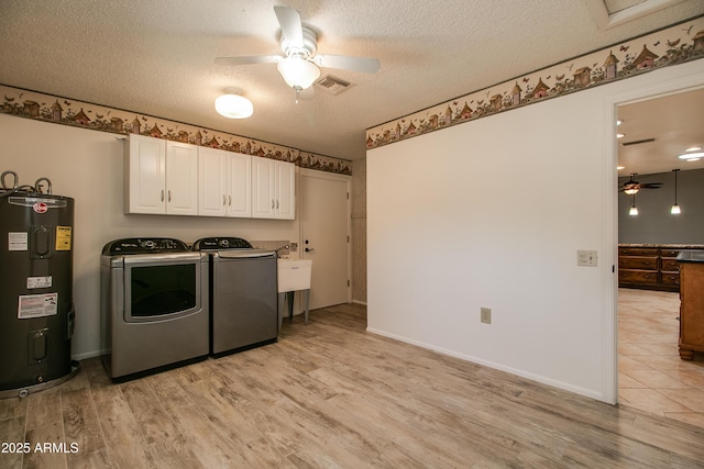 laundry area with washer and dryer, a ceiling fan, cabinet space, and electric water heater