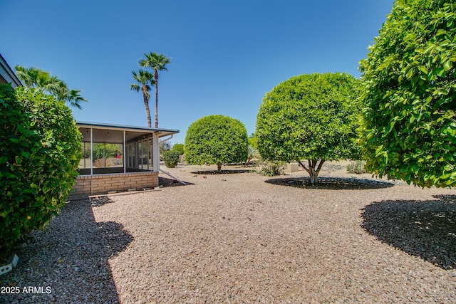view of yard with a sunroom