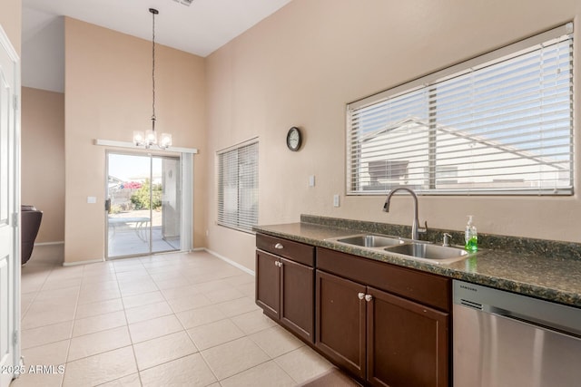 kitchen featuring sink, a chandelier, hanging light fixtures, stainless steel dishwasher, and light tile patterned floors