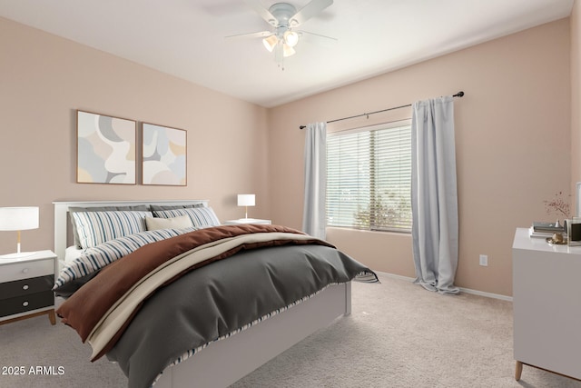 bedroom with light colored carpet and ceiling fan