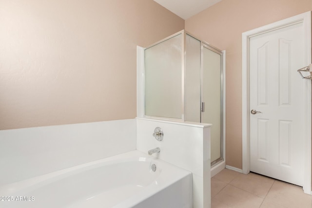 bathroom featuring shower with separate bathtub and tile patterned flooring