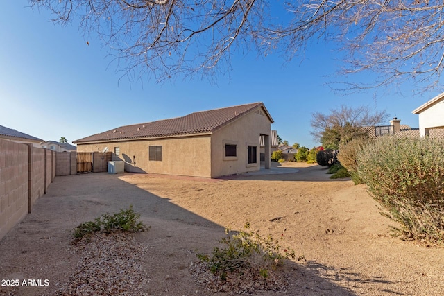 back of property featuring a patio