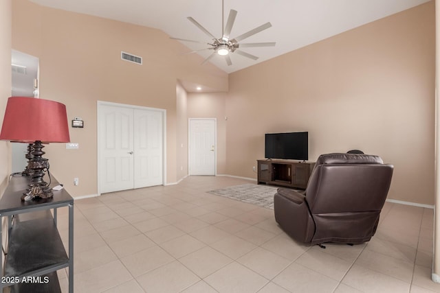 living room featuring high vaulted ceiling, ceiling fan, and light tile patterned flooring