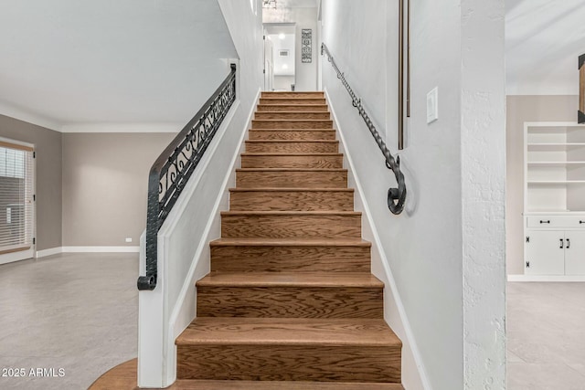 stairs featuring ornamental molding