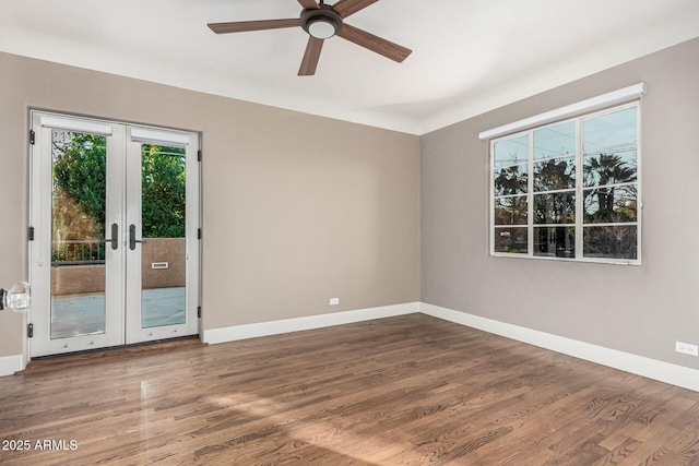 spare room featuring ceiling fan, french doors, and hardwood / wood-style floors