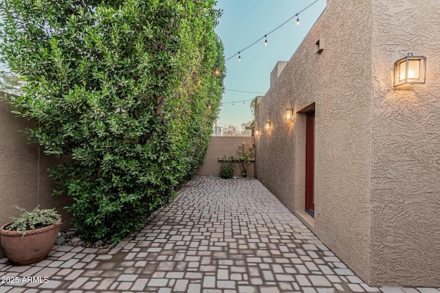 view of property exterior featuring a patio