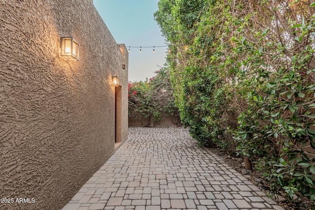 view of side of home featuring a patio