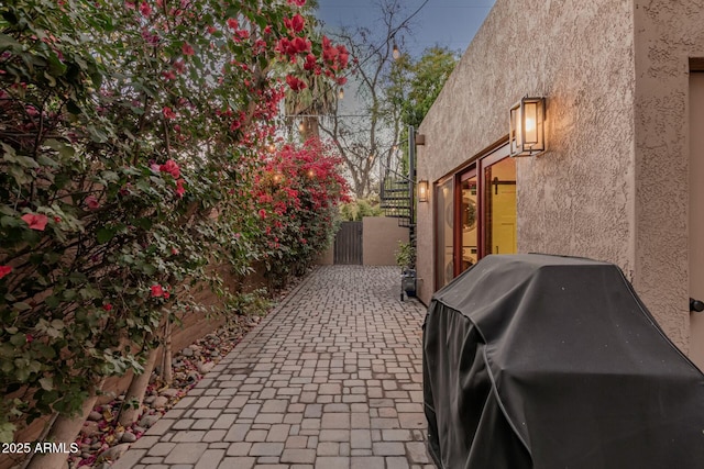 view of side of property featuring a patio