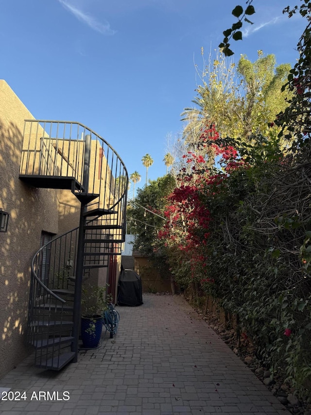 view of gate with a patio area