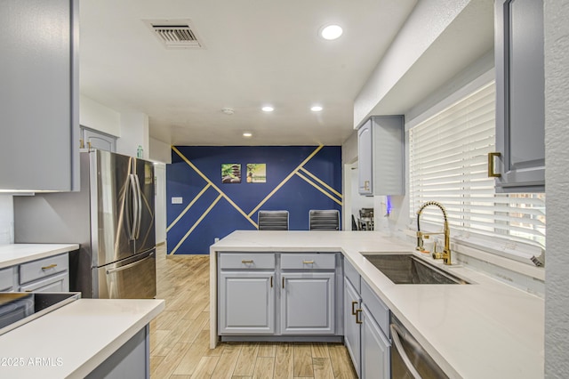 4162 W Sierra St, Phoenix, AZ 85029 - kitchen with gray cabinetry, a sink, recessed lighting, and light countertops