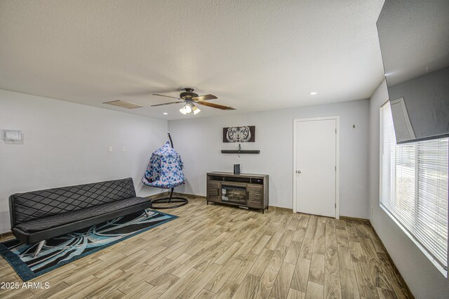 4162 W Sierra St, Phoenix, AZ 85029 - sitting room featuring wood finished floors, a ceiling fan, recessed lighting, a textured ceiling, and baseboards
