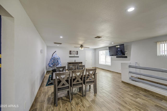 4162 W Sierra St, Phoenix, AZ 85029 - dining space featuring a ceiling fan, wood finished floors, baseboards, a textured ceiling, and recessed lighting