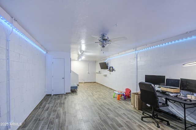 4162 W Sierra St, Phoenix, AZ 85029 - office area with wood finished floors, a ceiling fan, and concrete block wall