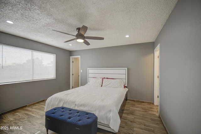4162 W Sierra St, Phoenix, AZ 85029 - bedroom with a textured ceiling, wood finished floors, recessed lighting, a ceiling fan, and baseboards