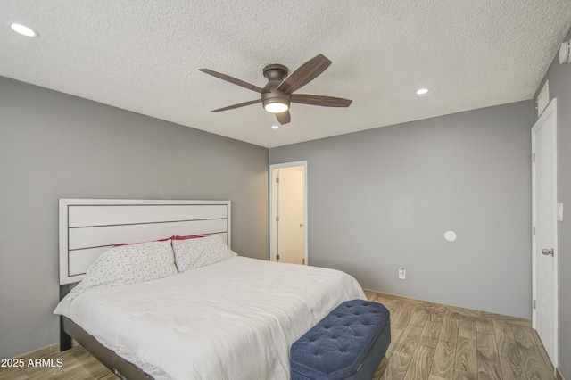 4162 W Sierra St, Phoenix, AZ 85029 - bedroom with wood finished floors, recessed lighting, a textured ceiling, ceiling fan, and baseboards