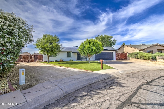 4162 W Sierra St, Phoenix, AZ 85029 - view of front of house featuring concrete driveway and solar panels