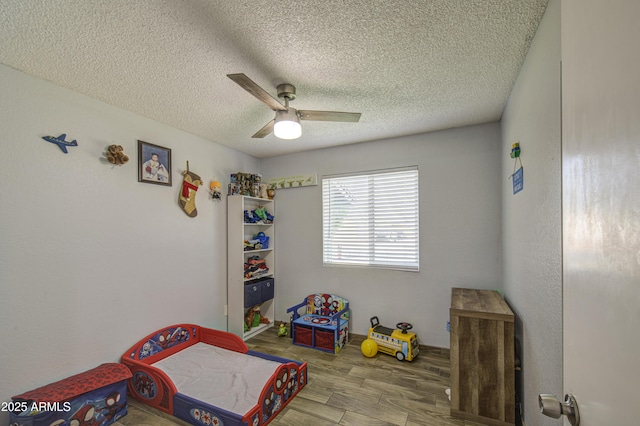 4162 W Sierra St, Phoenix, AZ 85029 - bedroom with wood finished floors, a textured ceiling, and a ceiling fan