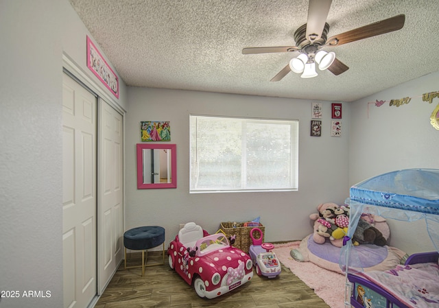 4162 W Sierra St, Phoenix, AZ 85029 - playroom featuring a textured ceiling, wood finished floors, and ceiling fan