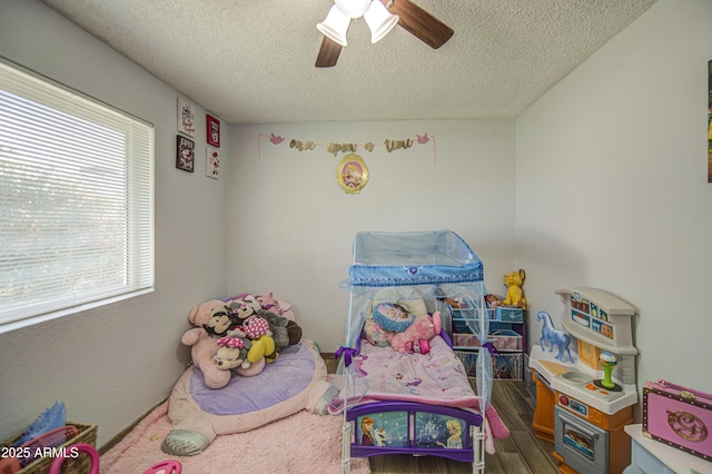 4162 W Sierra St, Phoenix, AZ 85029 - rec room featuring a textured ceiling, a ceiling fan, and wood finished floors