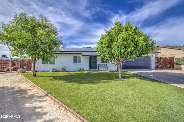 4162 W Sierra St, Phoenix, AZ 85029 - view of front of property featuring driveway, roof mounted solar panels, stucco siding, and an attached garage