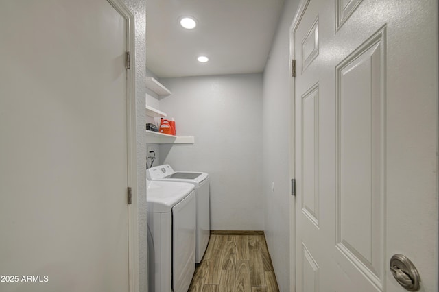 4162 W Sierra St, Phoenix, AZ 85029 - laundry area with light wood-style floors, separate washer and dryer, recessed lighting, and baseboards