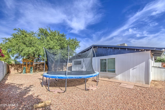 4162 W Sierra St, Phoenix, AZ 85029 - back of property with a trampoline, a playground, and a fenced backyard