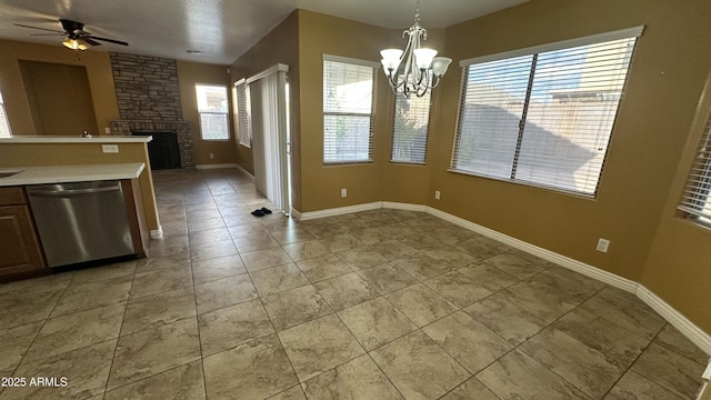 7511 S 45th Dr, Laveen, AZ 85339 - unfurnished dining area featuring a fireplace, light tile patterned floors, ceiling fan with notable chandelier, and baseboards