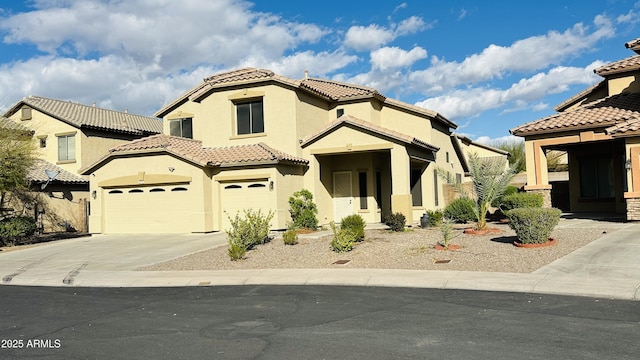 7511 S 45th Dr, Laveen, AZ 85339 - mediterranean / spanish-style house with stucco siding, driveway, a tile roof, and a garage