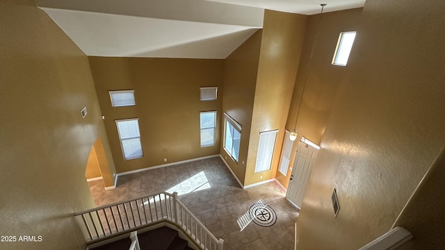 7511 S 45th Dr, Laveen, AZ 85339 - interior space featuring tile patterned floors, visible vents, a high ceiling, and baseboards