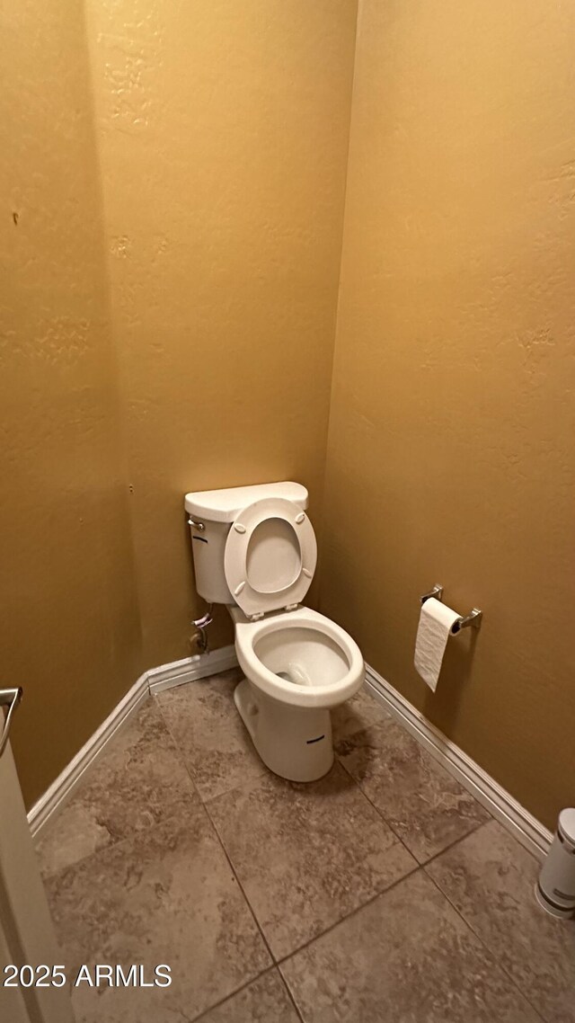 7511 S 45th Dr, Laveen, AZ 85339 - bathroom featuring baseboards and toilet