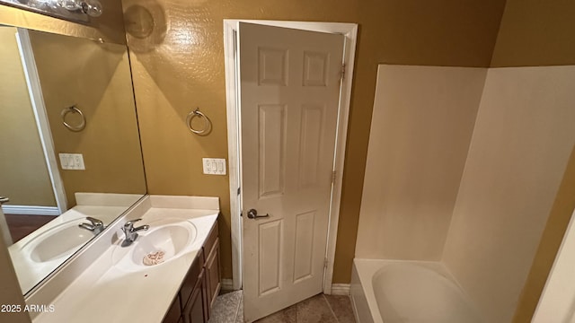 7511 S 45th Dr, Laveen, AZ 85339 - bathroom featuring tile patterned floors, baseboards, and vanity