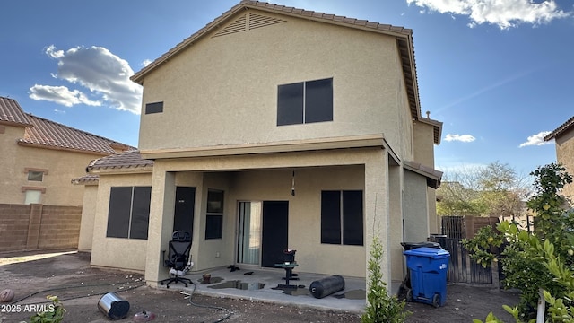 7511 S 45th Dr, Laveen, AZ 85339 - rear view of house featuring a patio, fence, and stucco siding