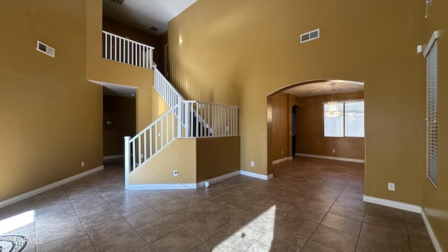 7511 S 45th Dr, Laveen, AZ 85339 - empty room featuring arched walkways, visible vents, and baseboards