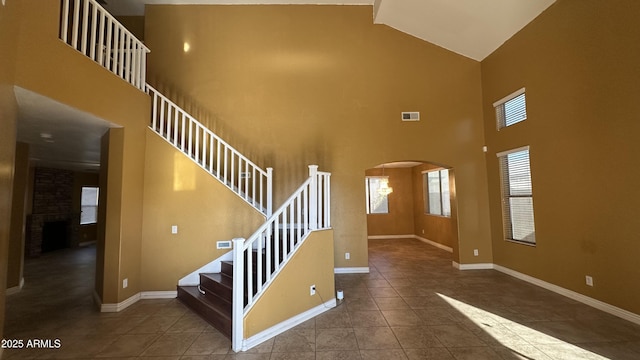 7511 S 45th Dr, Laveen, AZ 85339 - stairs with arched walkways, visible vents, tile patterned floors, and baseboards