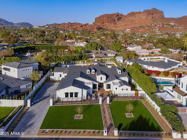 birds eye view of property with a mountain view