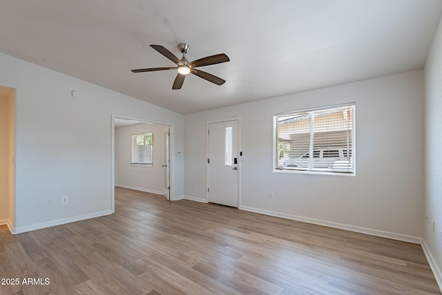 1219 E Colter St Unit 8, Phoenix, AZ 85014 - foyer entrance featuring a ceiling fan, light wood-style flooring, vaulted ceiling, and baseboards