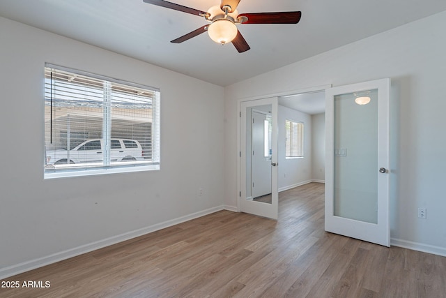 1219 E Colter St Unit 8, Phoenix, AZ 85014 - unfurnished bedroom with french doors, light wood finished floors, baseboards, lofted ceiling, and a ceiling fan