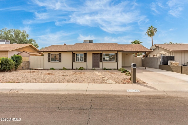 single story home with a carport