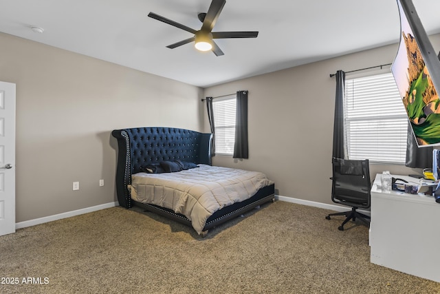 carpeted bedroom with ceiling fan and baseboards