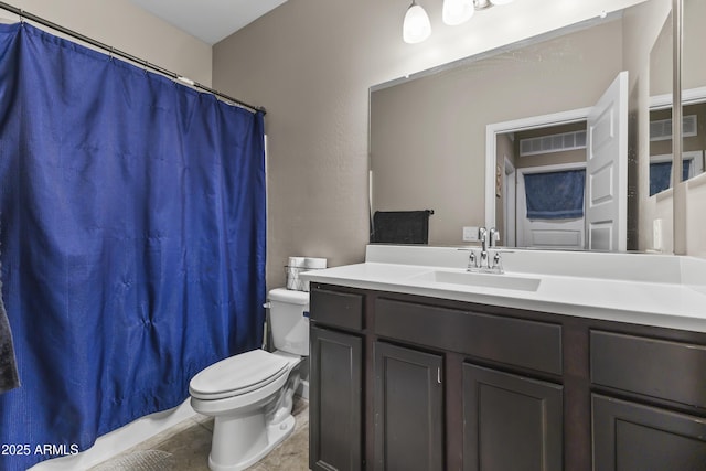 full bathroom with visible vents, vanity, toilet, and tile patterned floors