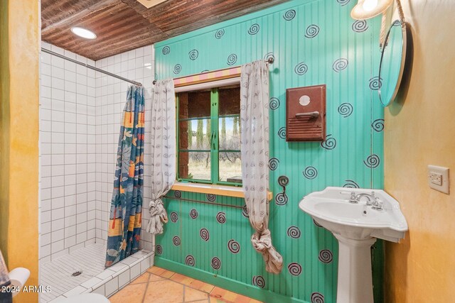 bathroom featuring tile patterned flooring, a shower with curtain, toilet, and wood ceiling