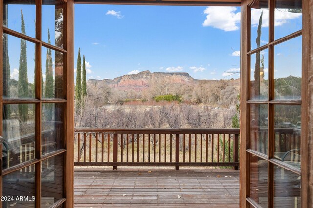 wooden deck with a mountain view